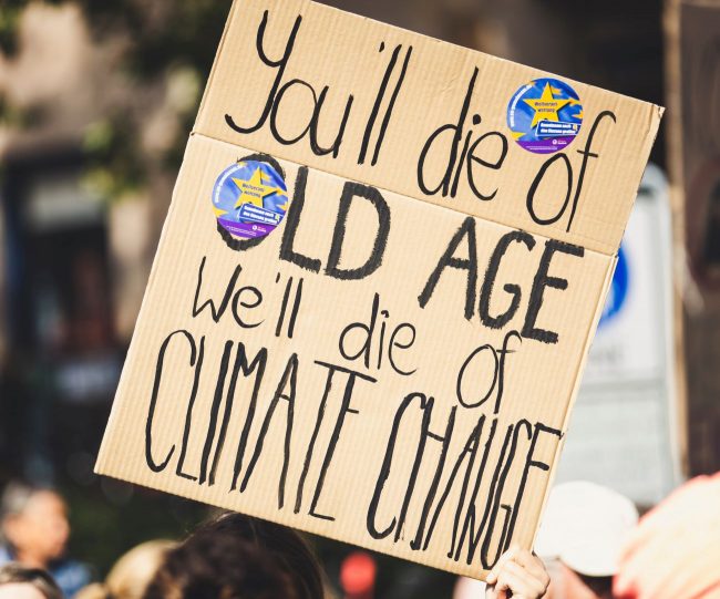 Banner: You`ll die of old age we`ll die of climate change